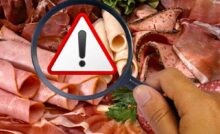 salumi, lente di ingrandimento e segnale attenzione
